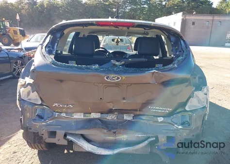 2015 Ford Focus Titanium z USA, uszkodzony, nr VIN 1FADP3N21FL228479